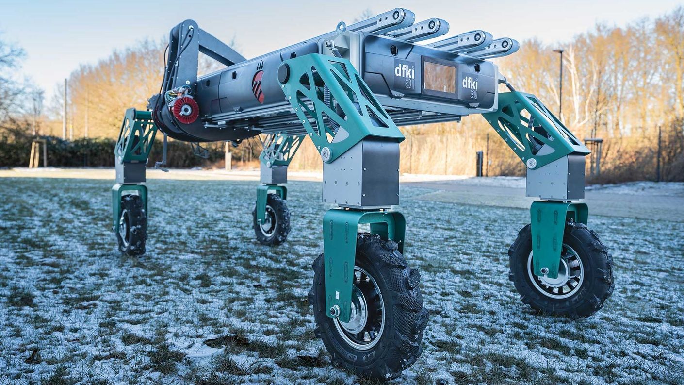 The strawberry-picking robot on a field in winter landscape